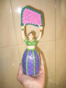 Small Indian doll with notice by Lola Quiros