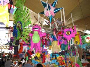 Market stall at the Coyoacan market that sold fruit and pinatas