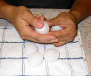 Flattening the ends of the styrofoam eggs