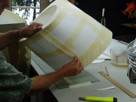 Adding additional layers of tape to strengthen thin foam panels.