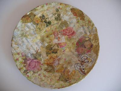 "collage on a papermache plate" by Ruth Gal
