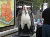 "Life-size penguin at comic convention" by Art Lopez