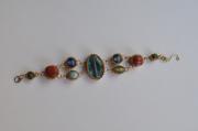 Prestigious bracelet gemstones embedded in different sizes and colors by Minna Ben-Nun