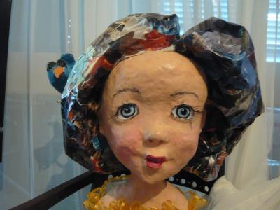 "head of a doll (she has a body' too}" by Tiva Noff
